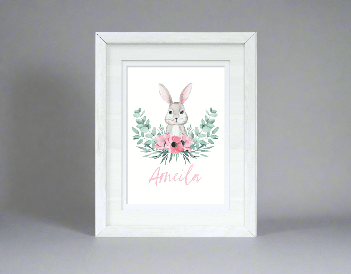 Personalised pink floral bunny Easter print displayed in children's room showing scale and framing options for  kids decor