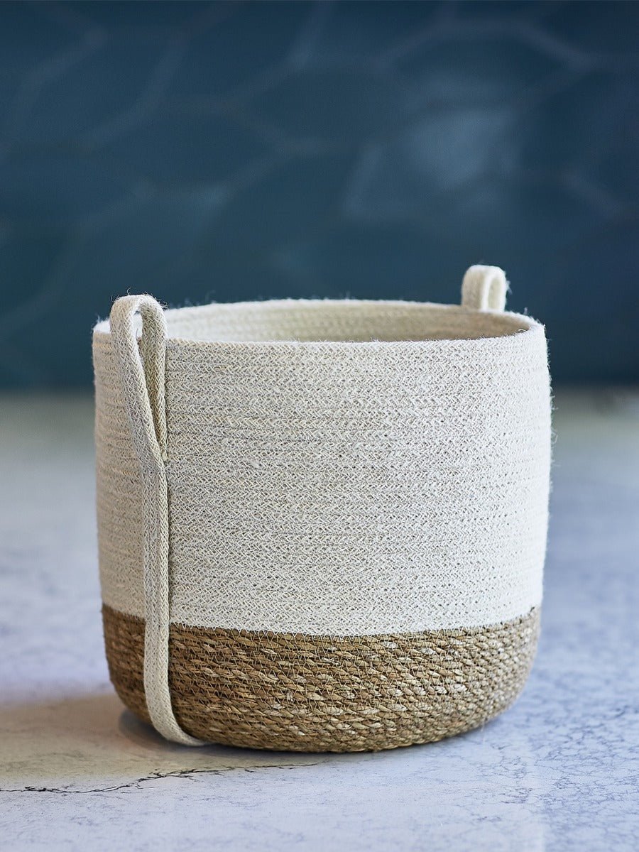 Handwoven Savar storage basket showcasing natural texture and artisan craftsmanship with practical side handle design